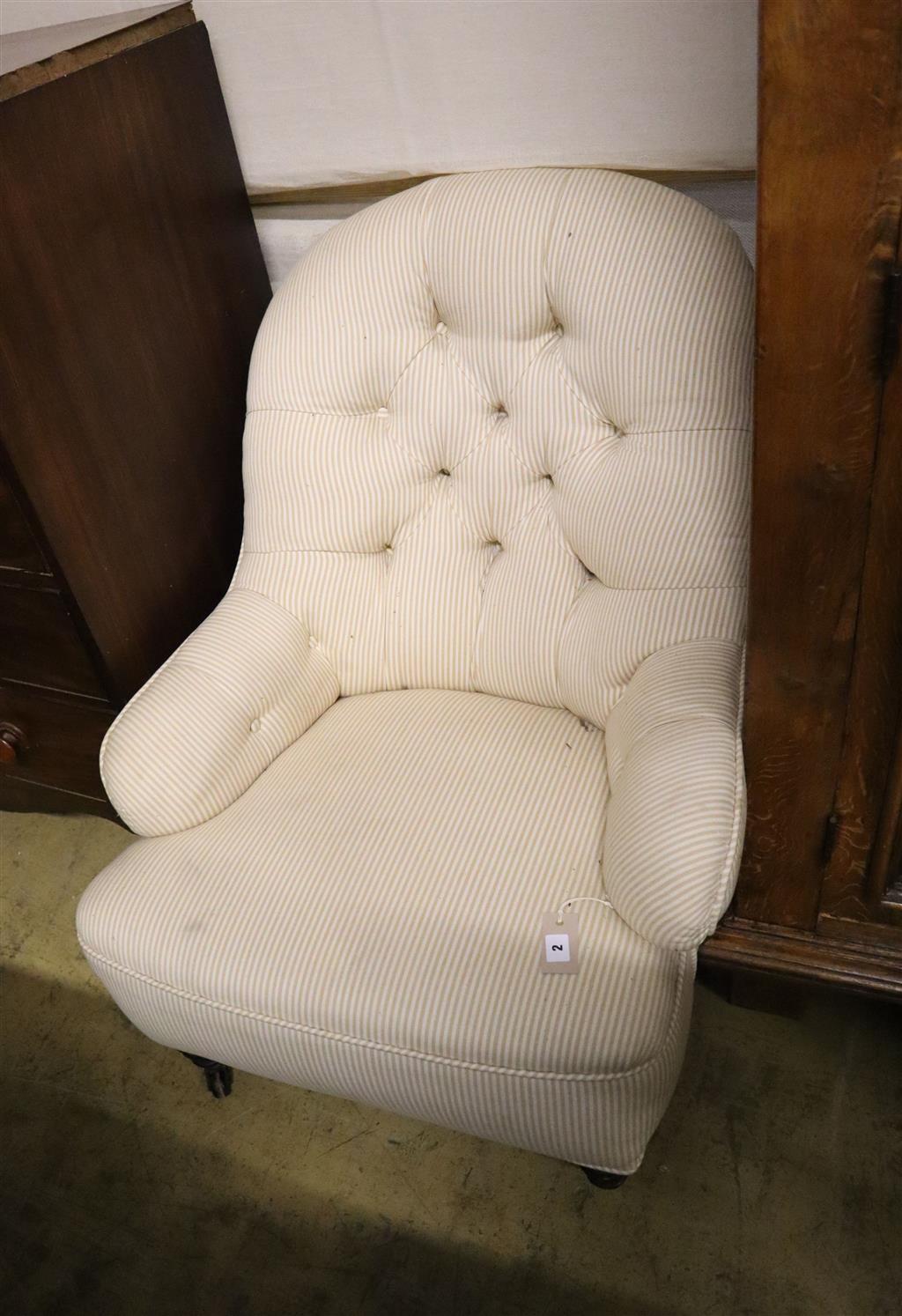 A Victorian upholstered spoonback armchair